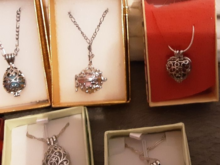 selection of homemade white metal necklaces