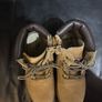 pair of tan/wheat leather boots with a padded dark brown collar. Image 4