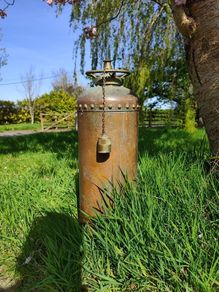 antique fire extinguisher perfect for man cave bar etc can be polished but looks better with the oxidation marks . Perfect condition