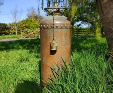 antique fire extinguisher perfect for man cave bar etc can be polished but looks better with the oxidation marks . Perfect condition