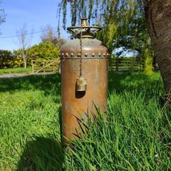 antique fire extinguisher perfect for man cave bar etc can be polished but looks better with the oxidation marks . Perfect condition