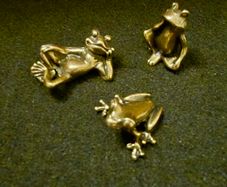 3 brass frogs.