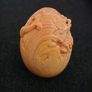 Carved wooden dragon hatching from an egg. Image 4