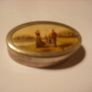a antique pill box with golfer on it Image 4
