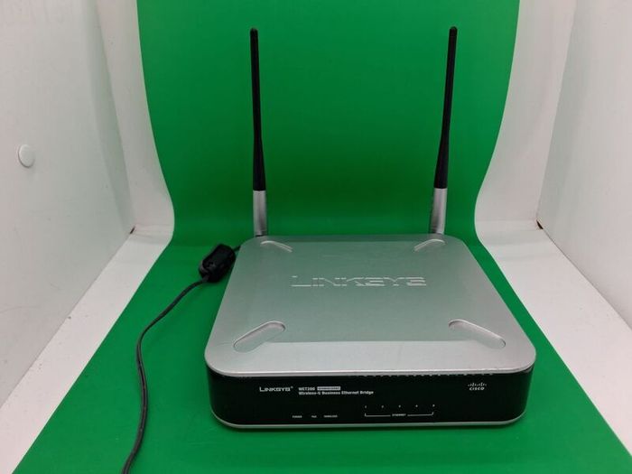 Postage - Linksys Cisco WET200 Wireless Ethernet Bridge Router.
