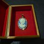 Vintage Cameo Goldtone Pendant on a Blue Background Image 2
