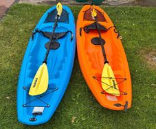 Two Sit on Kayaks