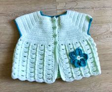 Baby girls hand made body warmer , new 6-12 m