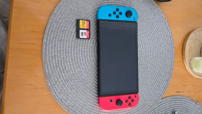 Nintendo Switch OLED + 2 Mario Games + Case & Accessories