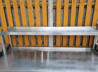 Stainless steel table with upstand