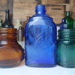 459 - Set of Three Beautiful Vintage Glass Decorative Collectible Bottles - Amber Eire Bovril, Cobalt Blue Magnesia and Turquoise Science Cream
