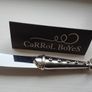A collectible knife made of polished pewter with a stainless steel blade from Carrol Boyes. Image 9