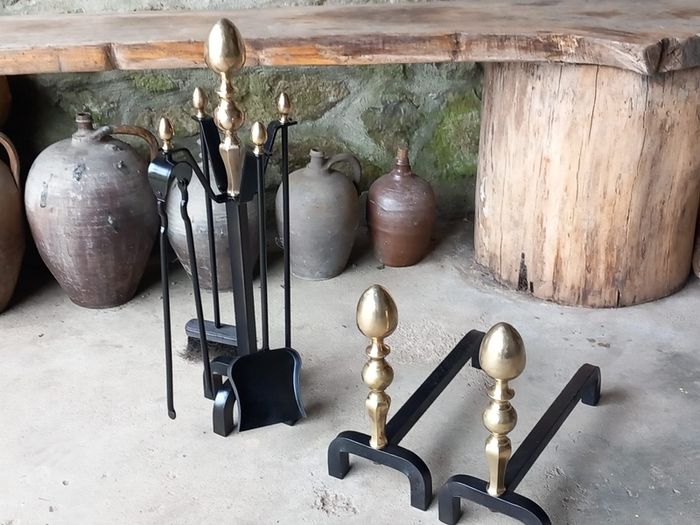 Antique Fire dogs and 4 piece fire set solid brass tops and steel