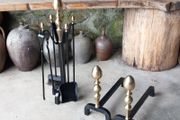 Antique Fire dogs and 4 piece fire set solid brass tops and steel