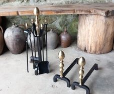 Antique Fire dogs and 4 piece fire set solid brass tops and steel