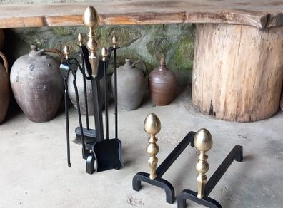 Antique Fire dogs and 4 piece fire set solid brass tops and steel