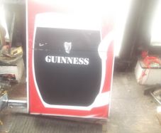 a large out door guinness item double sider