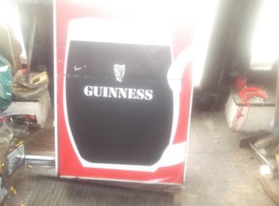 a large out door guinness item double sider