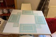 Table mats and matching coasters x 4 in glass