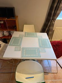 Table mats and matching coasters x 4 in glass