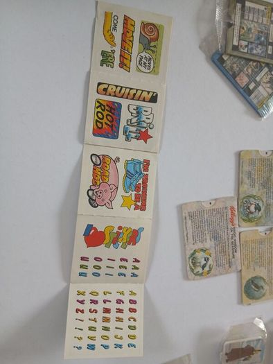 Scrace lot of 1980s retro cereal freebies . Kelloggs Rice crispies , sugar puffs stickers games and cards .