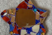 Small handcrafted star-shaped mosaic mirror