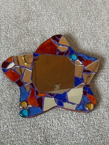 Small handcrafted star-shaped mosaic mirror