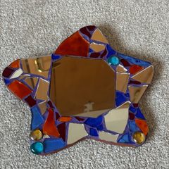 Small handcrafted star-shaped mosaic mirror