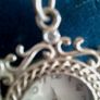 Ladies Quartz Necklace Watch with Filigree Design on Casing and Surrounded by 8 White-Silver Diamante Stones. Image 4