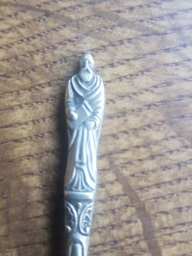 Vintage teaspoon with a saint on the handle