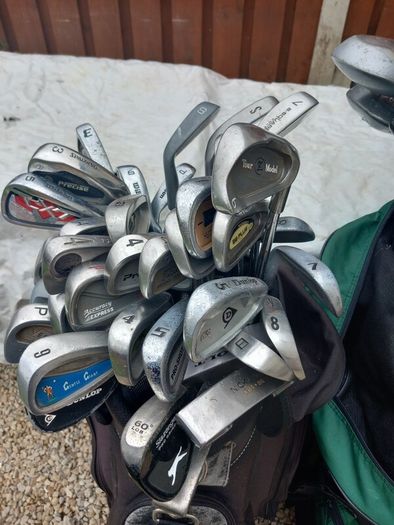 A selection of golf clubs and bags. NOT SELLING SEPARATE