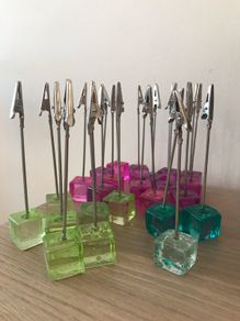 24 table number holders  + 2 raffle books