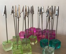 24 table number holders  + 2 raffle books