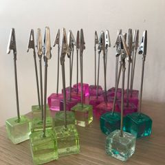 24 table number holders  + 2 raffle books