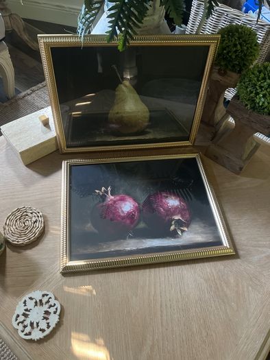 Two gold framed fruit prints.