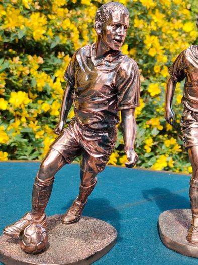 Two Gilded footballers