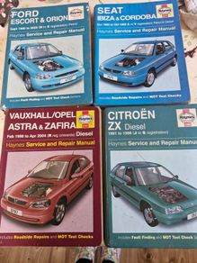 4 Haynes service and repair manuals for various car models.