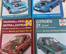 4 Haynes service and repair manuals for various car models.