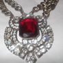 a lovely vintage  costome jewelley pendent with white stones and a large red stone Image 4