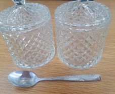 2 decorative storage jars with lids