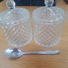 2 decorative storage jars with lids