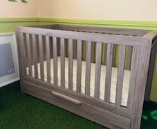 baby crib and baby changing chest of drawers