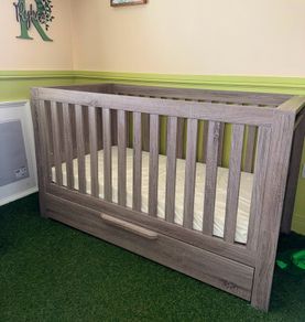 baby crib and baby changing chest of drawers