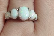 Sterling silver ring with lab opal.