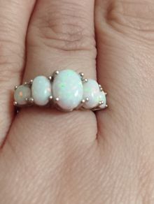 Sterling silver ring with lab opal.