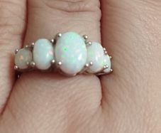 Sterling silver ring with lab opal.