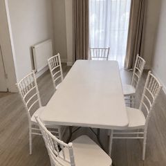 Outdoor table with plastic chairs