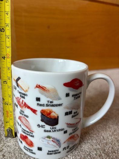 A Mug Featuring Different Types of Sushi