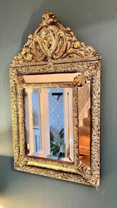 French repousse brass cushion mirror