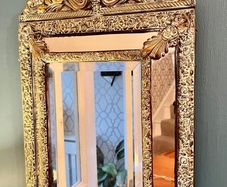 French repousse brass cushion mirror